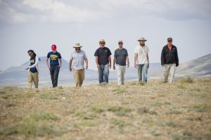 A group photo of UNCG professor, Dr. Robert Anemone's team in Wyoming's Great Divide Basin (left to right, Ashley Bryant, Michelle Stocker, Brett Nachman, Robert Anemone, Lee Phillips, Mike Michayluk, and Jay Emerson). The team was working on a National Science Foundation fund for the project "Developing and Testing New Geospatial Approaches in Paleoanthropology”. The project is using remotely sensed imagery to develop predictive models for the identification of potentially fossil-bearing localities. (David Wilson/UNCG photo)